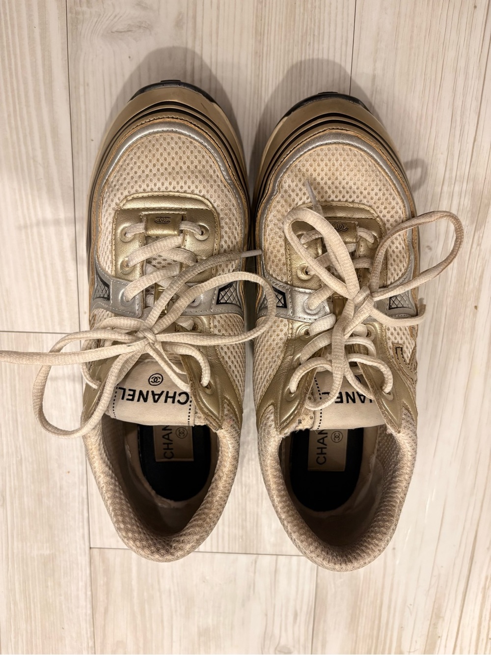 CHANEL Cream and Gold Lace-Up Sneakers